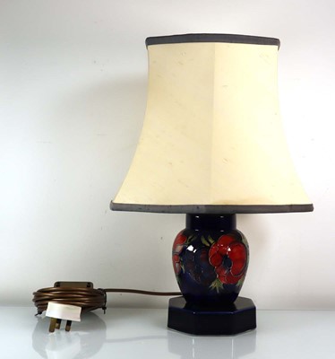 Lot 254 - A Moorcroft table lamp decorated in the...