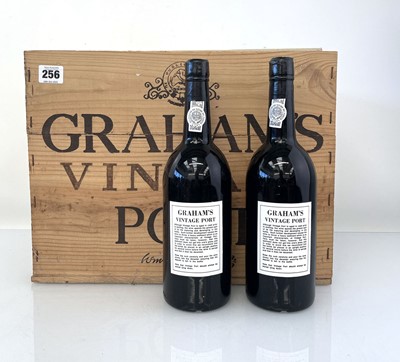 Lot 256 - A part wooden case of 9 bottles of 1975 W & J...