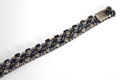 Lot 501 - A white metal articulated link bracelet set...