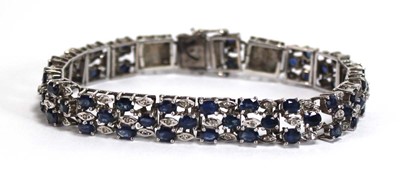 Lot 501 - A white metal articulated link bracelet set...