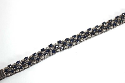 Lot 501 - A white metal articulated link bracelet set...