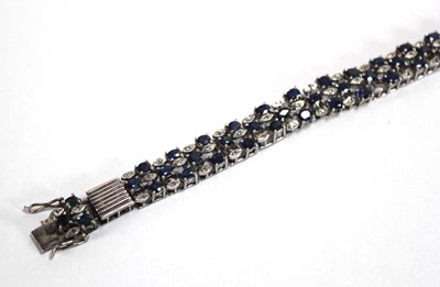 Lot 501 - A white metal articulated link bracelet set...