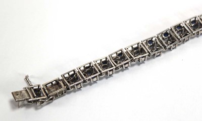 Lot 501 - A white metal articulated link bracelet set...