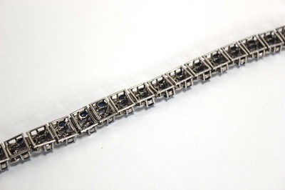 Lot 501 - A white metal articulated link bracelet set...
