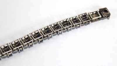 Lot 501 - A white metal articulated link bracelet set...