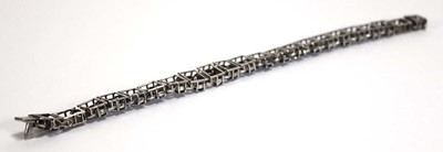 Lot 501 - A white metal articulated link bracelet set...