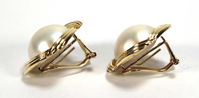 Lot 504 - A pair of 14ct yellow ear clips, each set a...