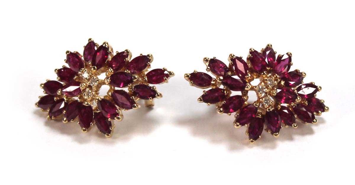 Lot 505 - A pair of 14ct yellow ear clips, each set...