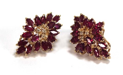 Lot 505 - A pair of 14ct yellow ear clips, each set...