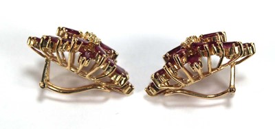 Lot 505 - A pair of 14ct yellow ear clips, each set...