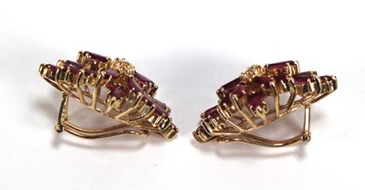 Lot 505 - A pair of 14ct yellow ear clips, each set...