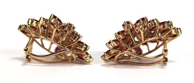 Lot 505 - A pair of 14ct yellow ear clips, each set...