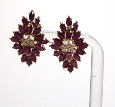 Lot 505 - A pair of 14ct yellow ear clips, each set...