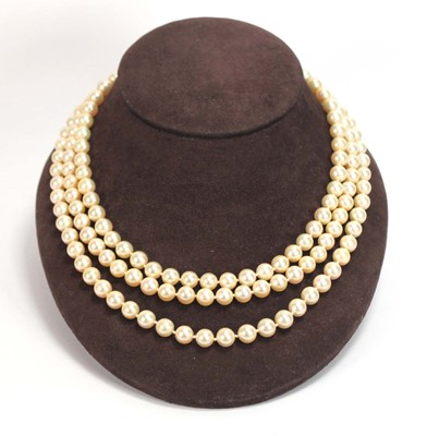 Lot 508 - A triple strand cultured pearl necklace with a...