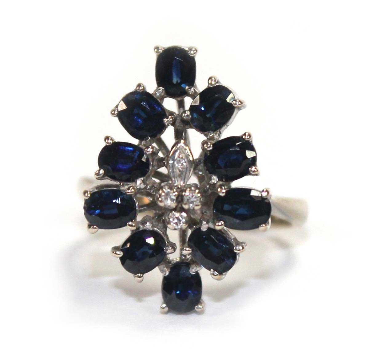 Lot 509 - A 14ct white gold cluster ring set four small...