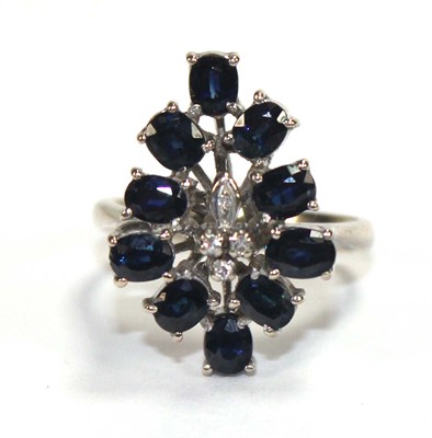 Lot 509 - A 14ct white gold cluster ring set four small...