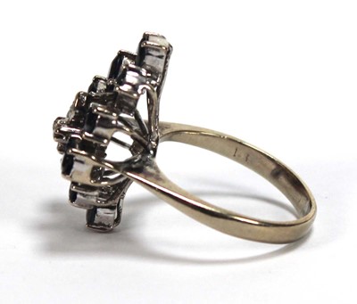 Lot 509 - A 14ct white gold cluster ring set four small...