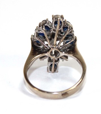 Lot 509 - A 14ct white gold cluster ring set four small...