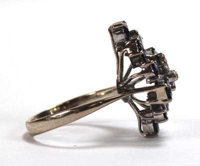 Lot 509 - A 14ct white gold cluster ring set four small...