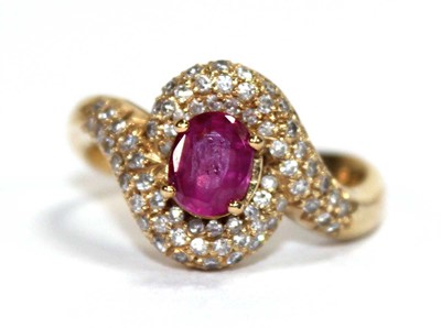 Lot 510 - An 18ct yellow gold crossover ring set oval...