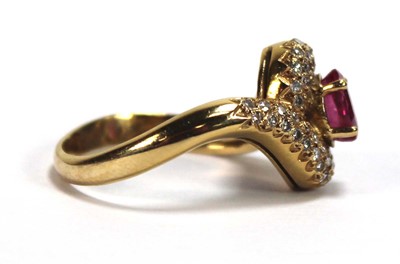 Lot 510 - An 18ct yellow gold crossover ring set oval...