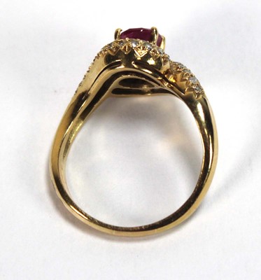 Lot 510 - An 18ct yellow gold crossover ring set oval...