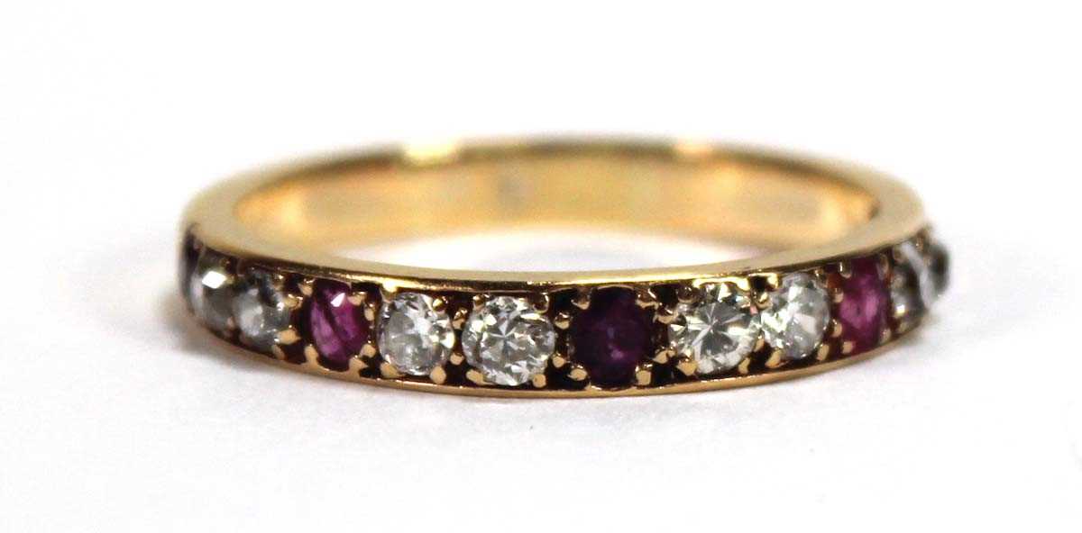 Lot 513 - A yellow metal half eternity ring set five...