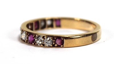 Lot 513 - A yellow metal half eternity ring set five...