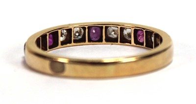 Lot 513 - A yellow metal half eternity ring set five...