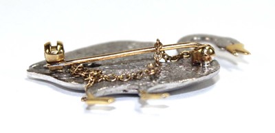 Lot 517 - An 18ct two-colour gold brooch in the form of...