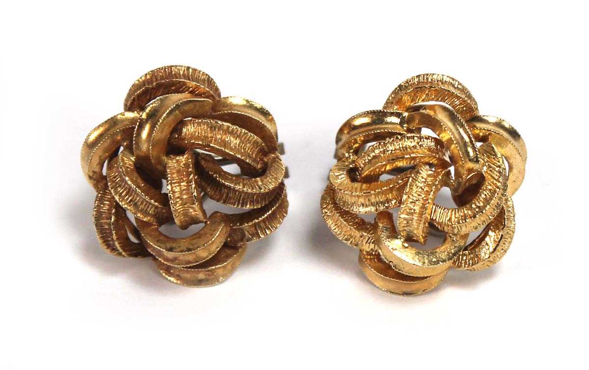 Lot 519 - A pair of 18ct yellow gold ear clips of knot...