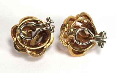 Lot 519 - A pair of 18ct yellow gold ear clips of knot...