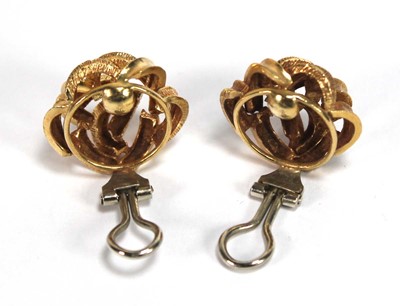 Lot 519 - A pair of 18ct yellow gold ear clips of knot...