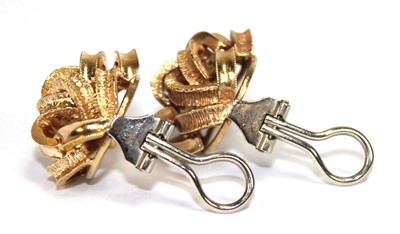 Lot 519 - A pair of 18ct yellow gold ear clips of knot...