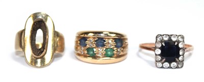 Lot 520 - A yellow metal ring set two rows of small...