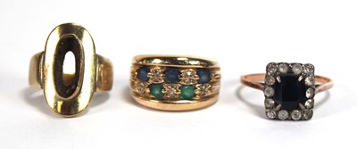 Lot 520 - A yellow metal ring set two rows of small...