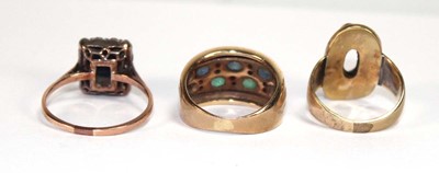 Lot 520 - A yellow metal ring set two rows of small...
