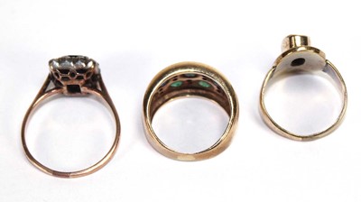 Lot 520 - A yellow metal ring set two rows of small...
