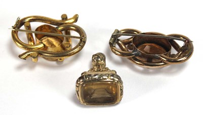 Lot 521 - A gilt metal watch fob set citrine, l. 3.4 cm,...