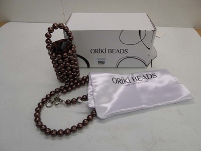 Lot 3752 - Oriki Beads arike handbag in brown with dust...