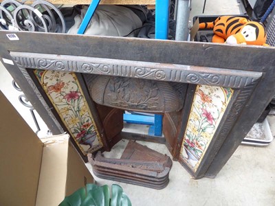 Lot 4235 - Cast iron fire surround with 2 tiled insert...