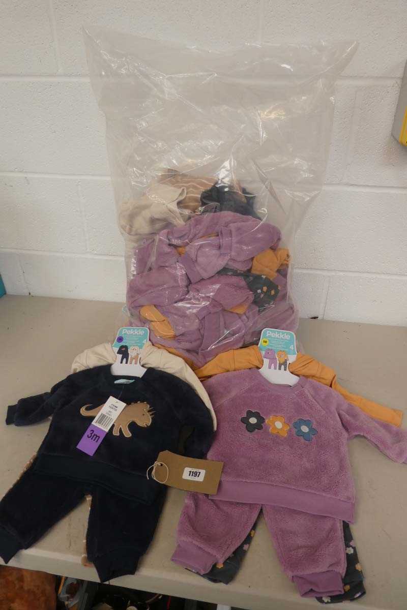 Lot 1197 - A bag containing a quantity of children's...