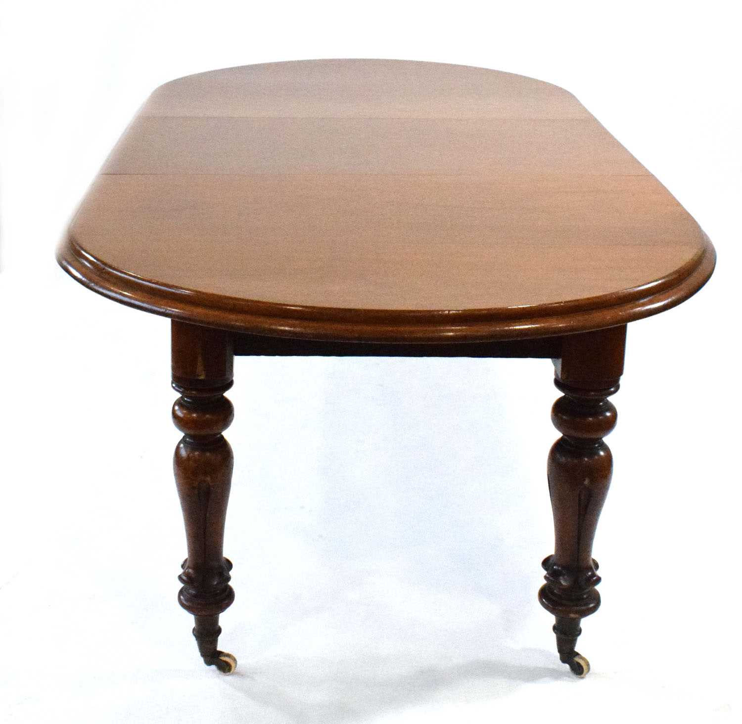 Lot 17 - A Victorian mahogany wind-out dining table...
