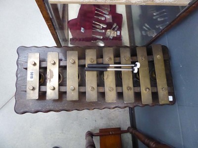 Lot 5019 - Brass glockenspiel on an oak stand