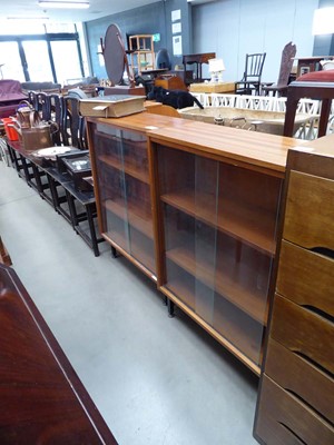 Lot 5180 - Pair of teak bookcases with sliding doors