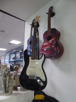 Lot 2104 - Squier Stratocaster electric six string guitar...