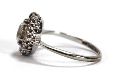 Lot 523 - An 18ct white gold cluster ring set old...