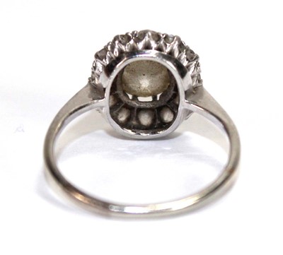 Lot 523 - An 18ct white gold cluster ring set old...