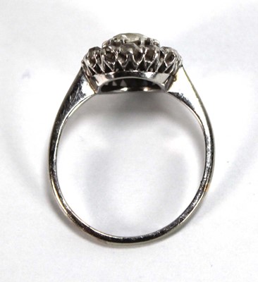 Lot 523 - An 18ct white gold cluster ring set old...