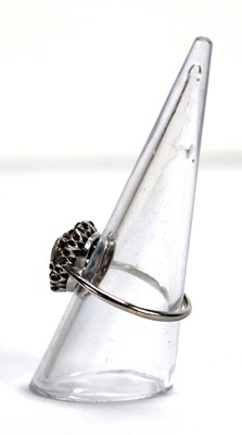 Lot 523 - An 18ct white gold cluster ring set old...